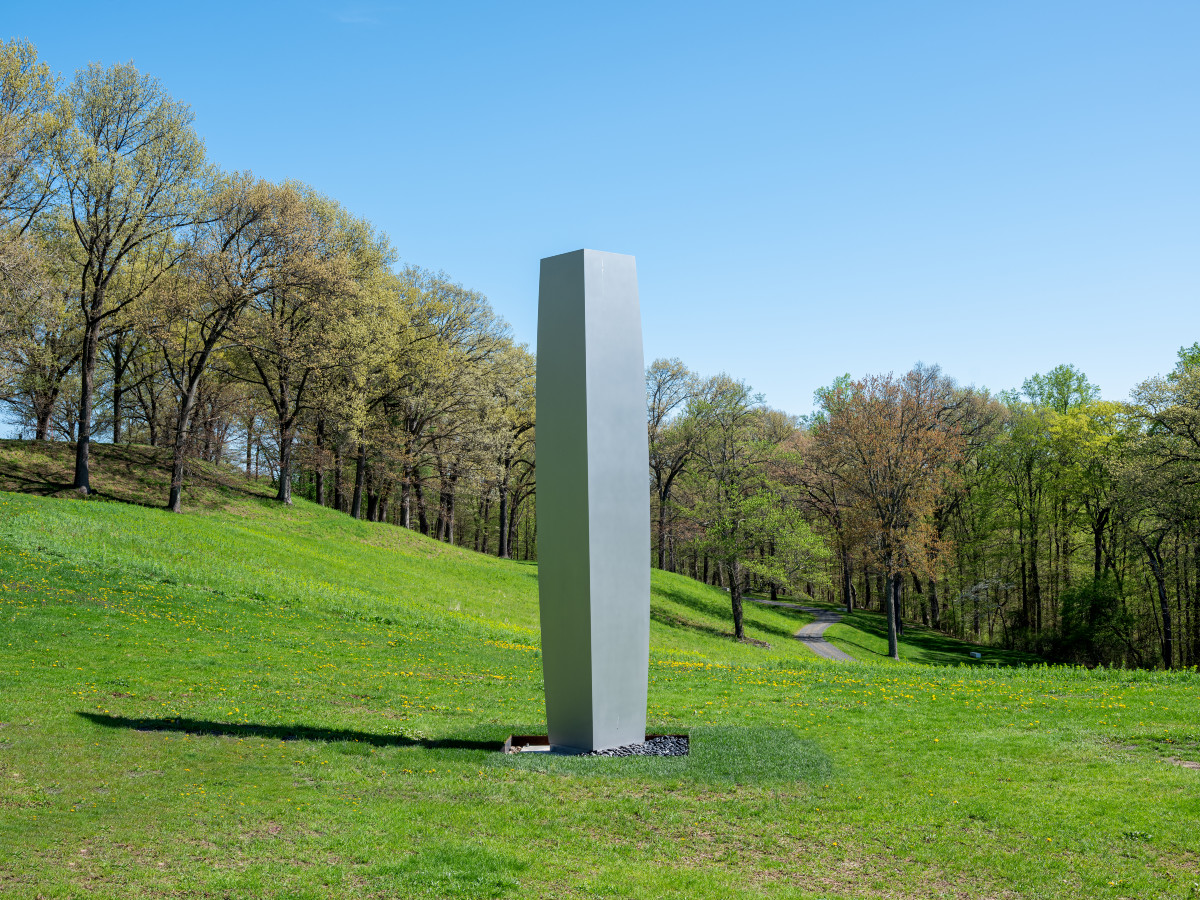 A stainless steel sculpture by Ellsworth Kelly installed on Storm King's east hillside is comprised of two perpendicular columns that share one edge.